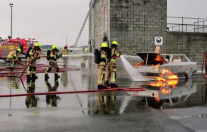 Advancing fire hose lines on car fire at Auckland Airport NZ